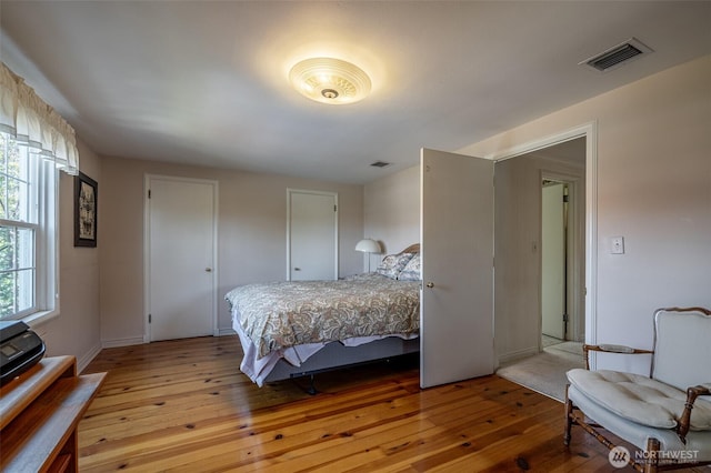 601 Yakima St, Wenatchee, WA 98801 - bedroom featuring light wood finished floors and two closets