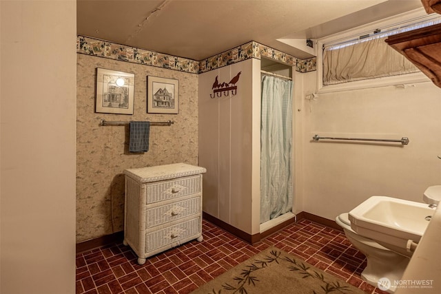601 Yakima St, Wenatchee, WA 98801 - full bathroom with brick patterned flooring, a stall shower, and wallpapered walls