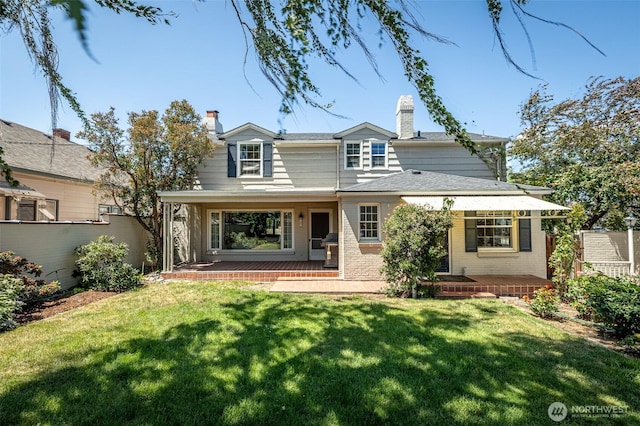 601 Yakima St, Wenatchee, WA 98801 - back of house with a chimney, brick siding, and a porch