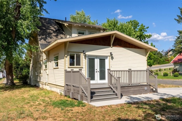 216 4th St E, Tonasket, WA 98855 - back of property featuring french doors and a wooden deck