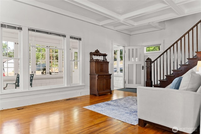 216 4th St E, Tonasket, WA 98855 - entryway featuring coffered ceiling, wood finished floors, healthy amount of natural light, stairs, and beamed ceiling