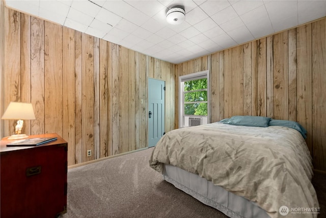 216 4th St E, Tonasket, WA 98855 - carpeted bedroom with wooden walls and cooling unit