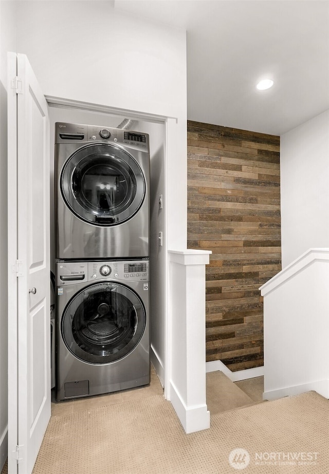 5955 Delridge Way SW, Seattle, WA 98106 - laundry area with stacked washer and clothes dryer, wood walls, and recessed lighting