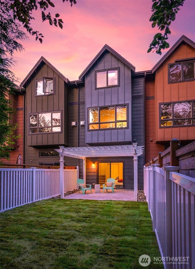 5955 Delridge Way SW, Seattle, WA 98106 - back of house at dusk with a patio area and board and batten siding