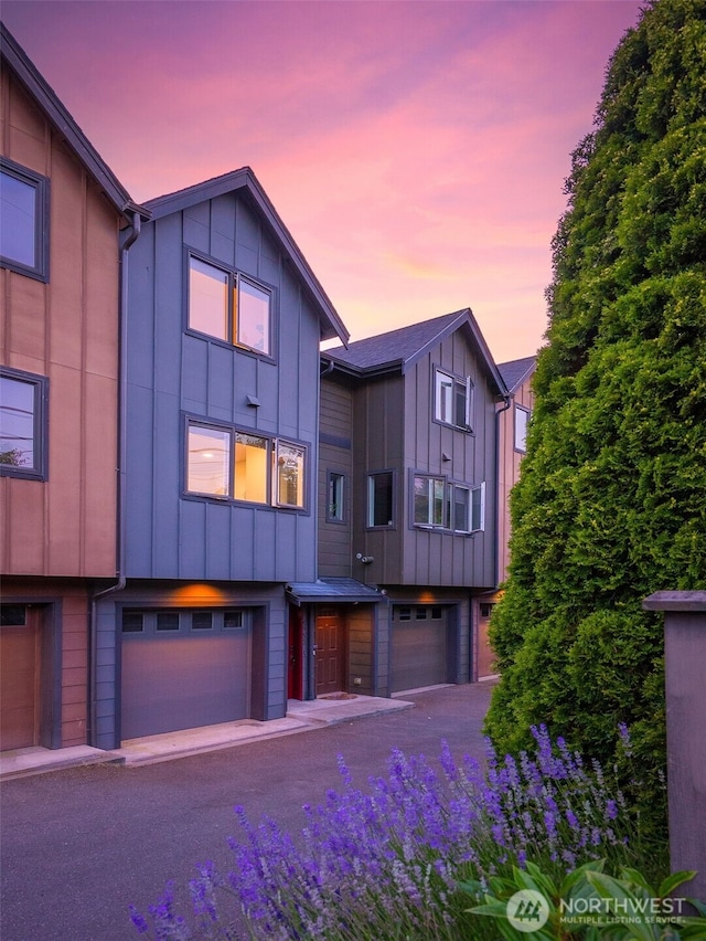 5955 Delridge Way SW, Seattle, WA 98106 - view of front of property with board and batten siding and an attached garage