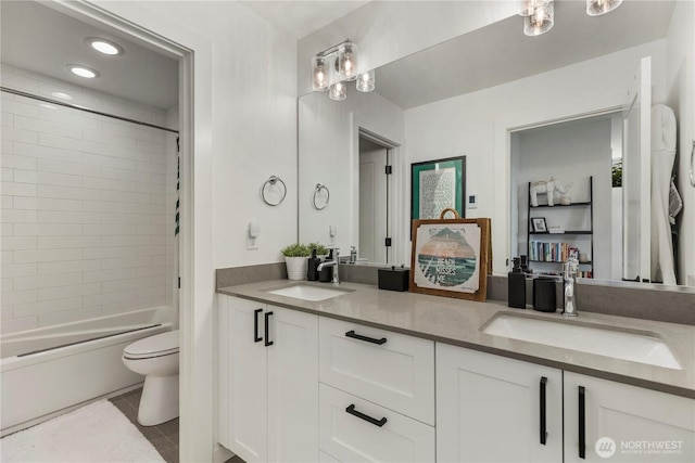 3418 23rd Ave W, Seattle, WA 98199 - bathroom with double vanity, tub / shower combination, tile patterned floors, and recessed lighting