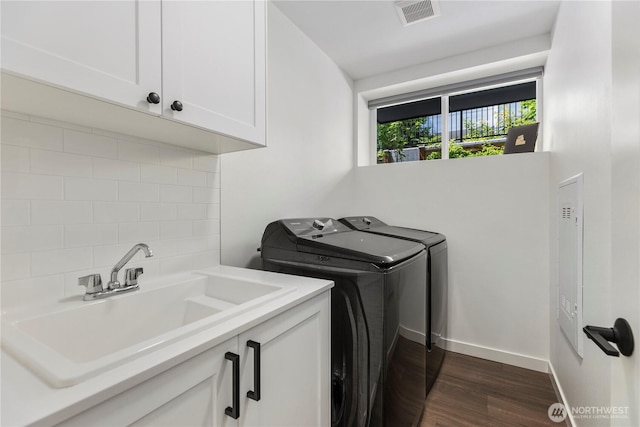 3418 23rd Ave W, Seattle, WA 98199 - laundry room with washer and dryer, cabinet space, and dark wood finished floors
