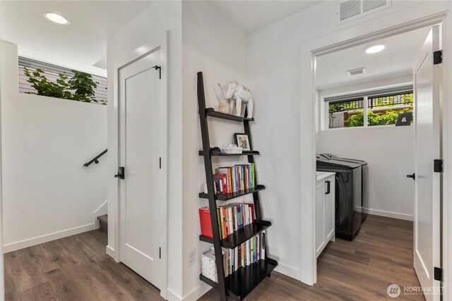 3418 23rd Ave W, Seattle, WA 98199 - hall with washing machine and dryer, dark wood-style floors, and recessed lighting