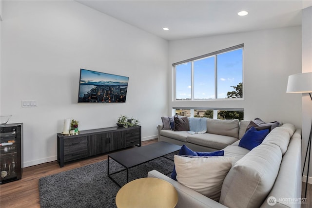 3418 23rd Ave W, Seattle, WA 98199 - living area featuring wood finished floors, recessed lighting, and vaulted ceiling