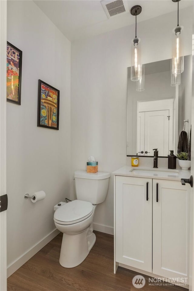 3418 23rd Ave W, Seattle, WA 98199 - half bathroom with wood finished floors and vanity