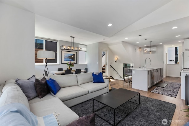 3418 23rd Ave W, Seattle, WA 98199 - living area featuring stairs, recessed lighting, lofted ceiling, and light wood-style flooring