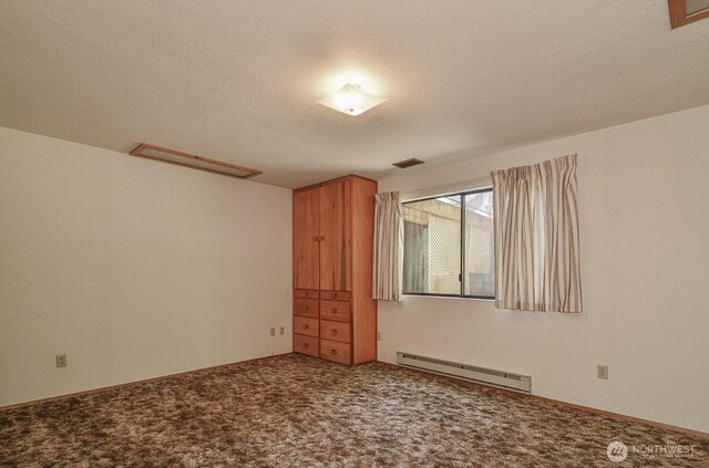 1203 Contra Costa Ave, Fircrest, WA 98466 - empty room featuring baseboard heating, carpet floors, and a textured ceiling