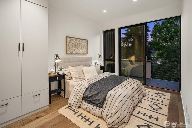 2236 Fairview Ave E Unit B, Seattle, WA 98102 - bedroom featuring wood finished floors, access to outside, and recessed lighting