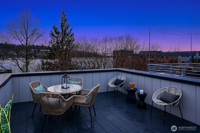 2236 Fairview Ave E Unit B, Seattle, WA 98102 - patio terrace at dusk with a balcony and outdoor dining space