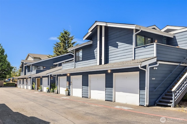 8408 18th Ave W Unit 10-101, Everett, WA 98204 - view of side of property featuring a balcony, stairs, and community garages