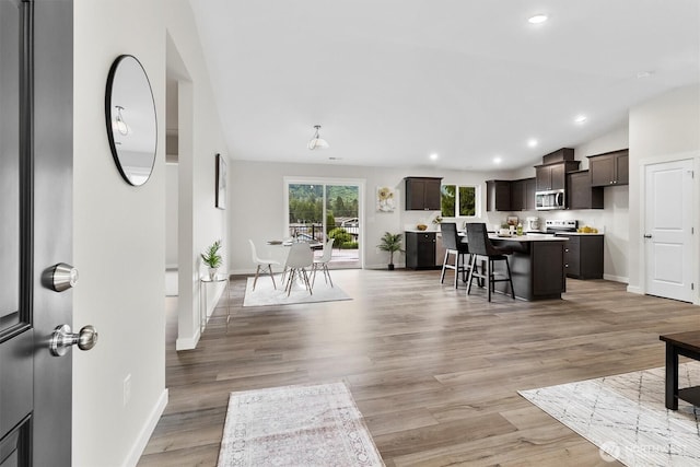 281 Shallow Shore Rd, Bellingham, WA 98229 - living area featuring lofted ceiling, light wood-style flooring, and recessed lighting