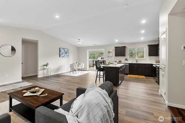 281 Shallow Shore Rd, Bellingham, WA 98229 - living area with vaulted ceiling, light wood-style flooring, and recessed lighting
