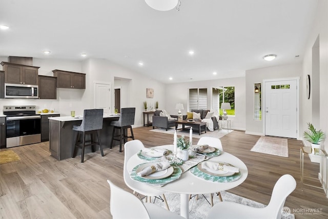 281 Shallow Shore Rd, Bellingham, WA 98229 - dining space featuring light wood finished floors, recessed lighting, and lofted ceiling