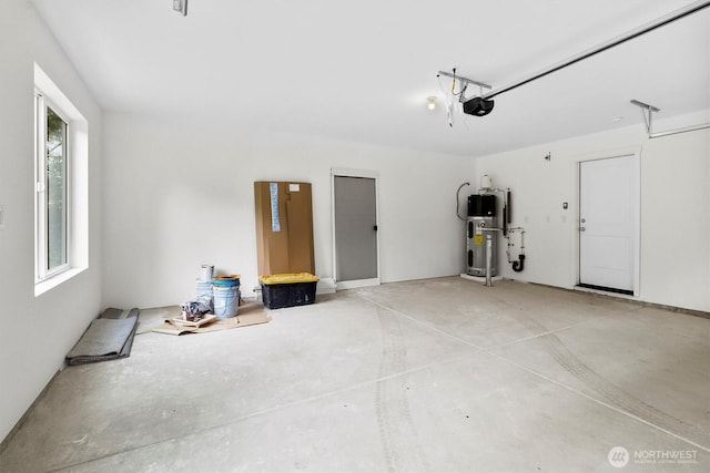 281 Shallow Shore Rd, Bellingham, WA 98229 - garage with a garage door opener and hybrid water heater