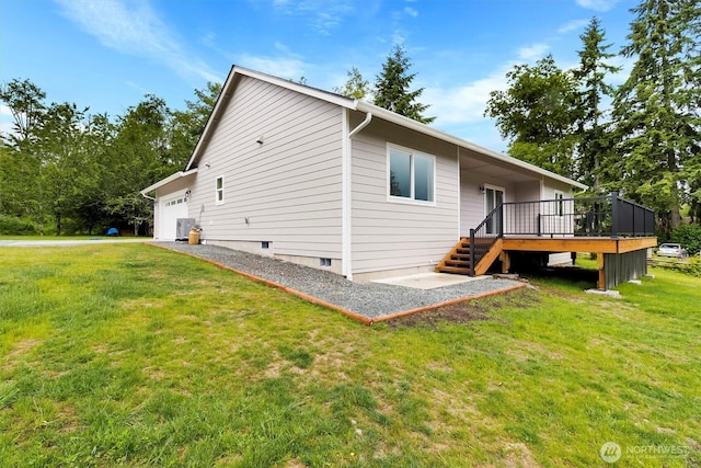 281 Shallow Shore Rd, Bellingham, WA 98229 - rear view of property with an attached garage, a deck, a lawn, and stairs