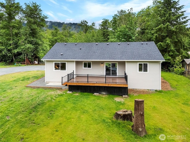 281 Shallow Shore Rd, Bellingham, WA 98229 - back of house with a lawn, a wooden deck, and a shingled roof