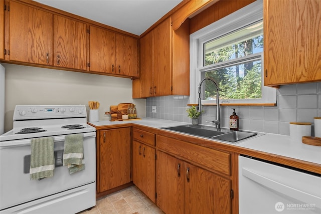 13523 23rd Pl NE, Seattle, WA 98125 - kitchen featuring white appliances, light countertops, decorative backsplash, and brown cabinetry