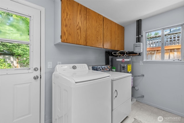 13523 23rd Pl NE, Seattle, WA 98125 - laundry room featuring cabinet space, washer and clothes dryer, and light marble finish floors