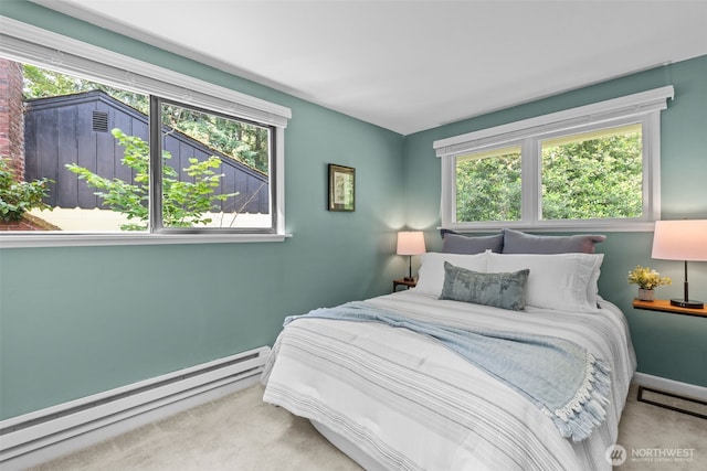 13523 23rd Pl NE, Seattle, WA 98125 - bedroom with baseboard heating, carpet floors, and multiple windows