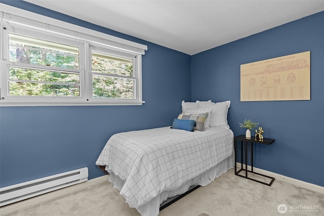 13523 23rd Pl NE, Seattle, WA 98125 - carpeted bedroom with a baseboard heating unit and baseboards