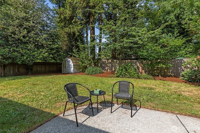 13523 23rd Pl NE, Seattle, WA 98125 - fenced backyard featuring a storage unit and a patio area
