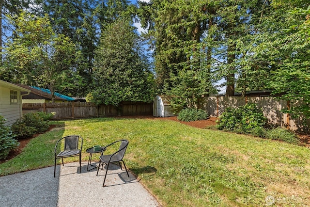 13523 23rd Pl NE, Seattle, WA 98125 - fenced backyard featuring a shed and a patio area