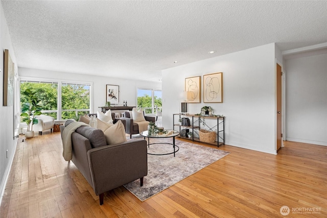 4815 N Huson St, Tacoma, WA 98407 - living room featuring a textured ceiling, light wood finished floors, and recessed lighting