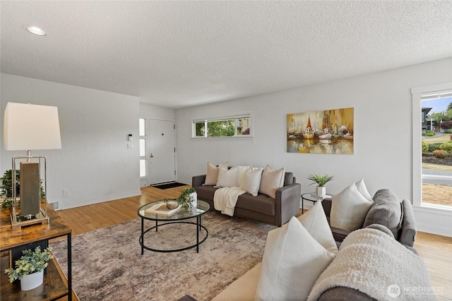 4815 N Huson St, Tacoma, WA 98407 - living room with wood finished floors, a textured ceiling, and recessed lighting