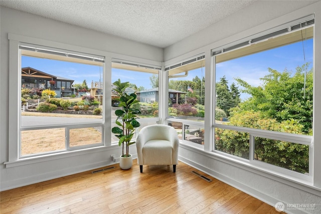 4815 N Huson St, Tacoma, WA 98407 - sunroom / solarium featuring hardwood / wood-style flooring and a textured ceiling