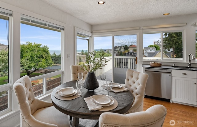 4815 N Huson St, Tacoma, WA 98407 - sunroom / solarium with healthy amount of natural light, wood finished floors, a textured ceiling, and recessed lighting