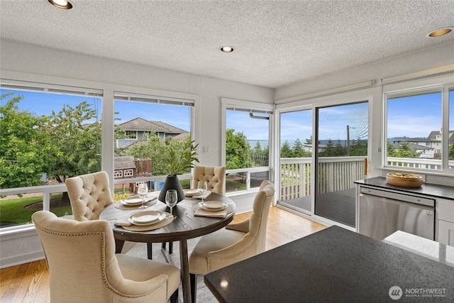 4815 N Huson St, Tacoma, WA 98407 - sunroom featuring wood finished floors, a textured ceiling, and recessed lighting