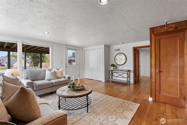 4815 N Huson St, Tacoma, WA 98407 - living area featuring a textured ceiling, light wood-style floors, and recessed lighting