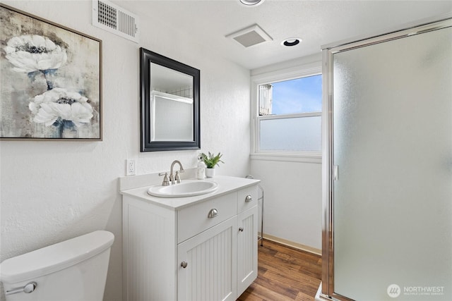 4815 N Huson St, Tacoma, WA 98407 - full bathroom featuring vanity, wood finished floors, and a shower stall