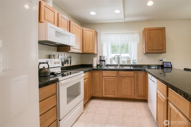 117 Bufflehead St SW, Ocean Shores, WA 98569 - kitchen featuring white appliances, dark countertops, recessed lighting, and light tile patterned floors