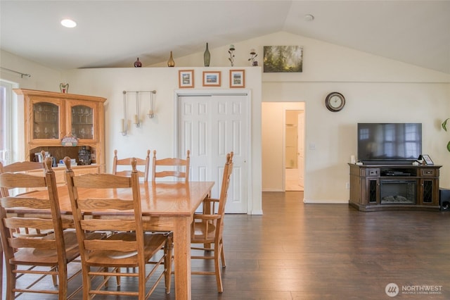 117 Bufflehead St SW, Ocean Shores, WA 98569 - dining space featuring vaulted ceiling and dark wood-style flooring