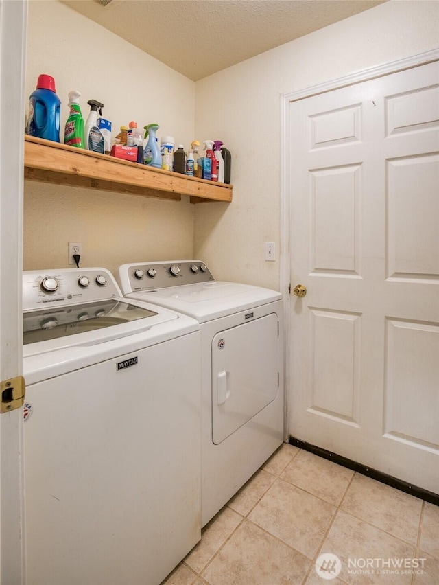 117 Bufflehead St SW, Ocean Shores, WA 98569 - washroom with washer and clothes dryer and light tile patterned floors
