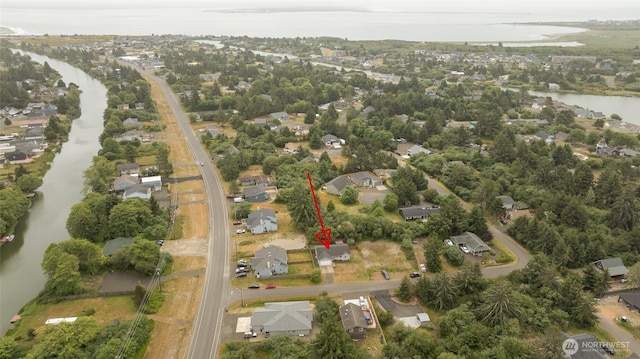 117 Bufflehead St SW, Ocean Shores, WA 98569 - aerial view of property's location with a nearby body of water and nearby suburban area