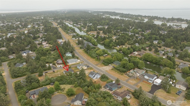 117 Bufflehead St SW, Ocean Shores, WA 98569 - aerial overview of property's location featuring a large body of water and nearby suburban area