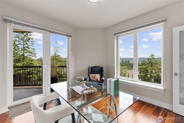 18707 SE Newport Way Unit 208, Issaquah, WA 98027 - dining space featuring wood finished floors