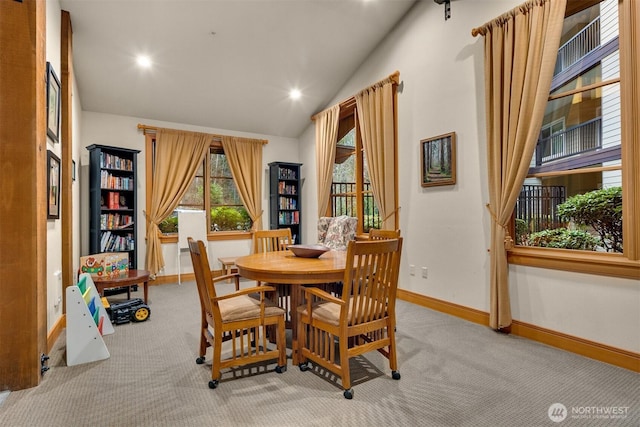 18707 SE Newport Way Unit 208, Issaquah, WA 98027 - dining room with carpet floors, lofted ceiling, and recessed lighting