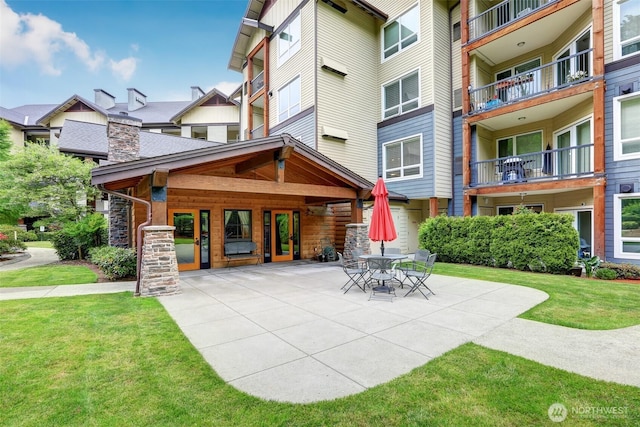 18707 SE Newport Way Unit 208, Issaquah, WA 98027 - view of community featuring a patio and a lawn