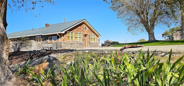 20354 Adrian Rd NE, Soap Lake, WA 98851 - view of side of property featuring stone siding and a metal roof