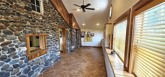 20354 Adrian Rd NE, Soap Lake, WA 98851 - unfurnished living room featuring healthy amount of natural light, high vaulted ceiling, a ceiling fan, and tile patterned floors