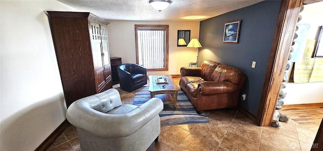 20354 Adrian Rd NE, Soap Lake, WA 98851 - living area featuring a textured ceiling and baseboards