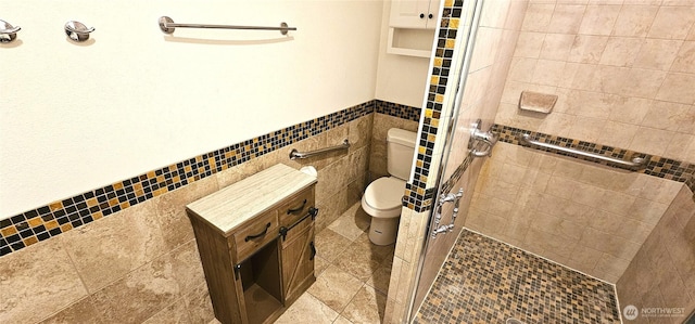 20354 Adrian Rd NE, Soap Lake, WA 98851 - bathroom with a stall shower, tile walls, and wainscoting